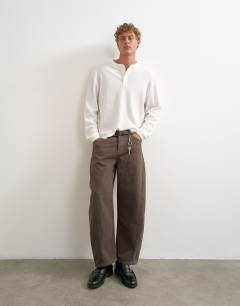 Model wearing Relaxed fit waffle henley with raw hem in washed ecru