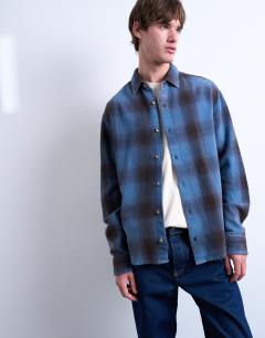 Model wearing Relaxed fit washed check shirt in blue