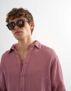 Model wearing Relaxed fit woven mesh shirt in washed pink
