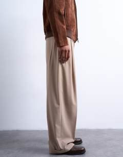 Model wearing Relaxed smart trousers in beige