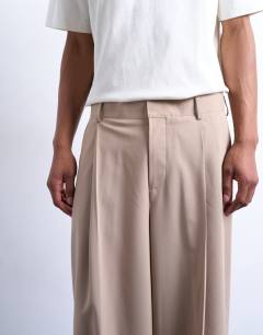 Model wearing Relaxed smart trousers in beige