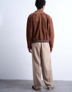 Model wearing Relaxed smart trousers in beige