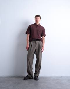 Model wearing Relaxed tapered pleated herringbone trouser in brown