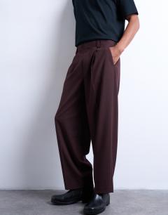 Model wearing Relaxed tapered trousers in burgundy