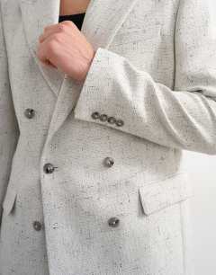 Model wearing Relaxed textured boucle blazer in cream