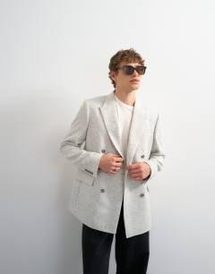 Model wearing Relaxed textured boucle blazer in cream