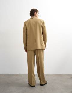 Model wearing Relaxed twill suit trousers in beige
