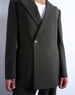 Model wearing Relaxed wool touch suit jacket in green