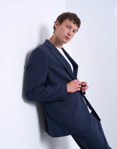 Model wearing Relaxed wool touch suit jacket in navy