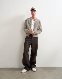 Model wearing Rigid baggy fit jean in raw brown