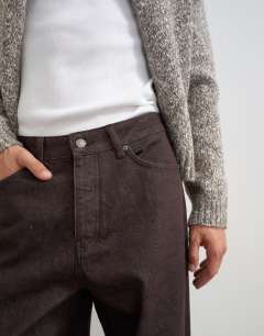 Model wearing Rigid baggy fit jean in raw brown