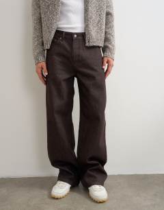 Model wearing Rigid baggy fit jean in raw brown