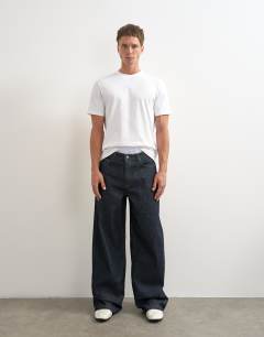 Model wearing Rigid baggy fit jean in raw