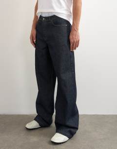 Model wearing Rigid baggy fit jean in raw