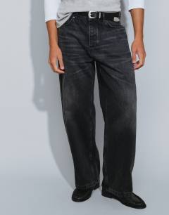 Model wearing Rigid baggy fit jean in washed black