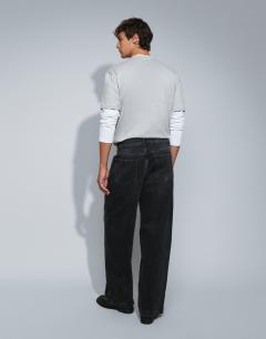 Model wearing Rigid baggy fit jean in washed black