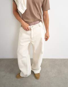 Model wearing Rigid baggy fit jean with side pockets in natural