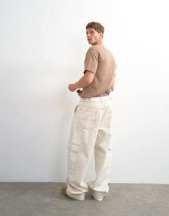Model wearing Rigid baggy fit jean with side pockets in natural