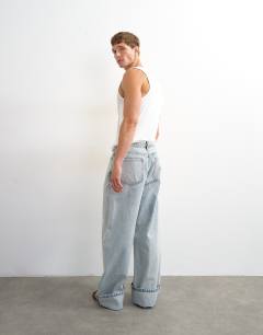 Model wearing Rigid baggy fit jean with turn-up in light wash