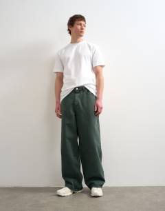 Model wearing Rigid baggy jean in green