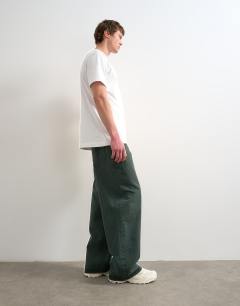 Model wearing Rigid baggy jean in green