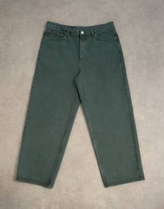 Model wearing Rigid baggy jean in green