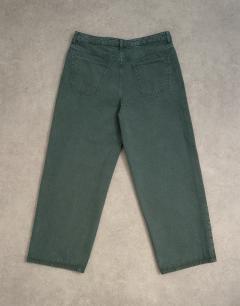 Model wearing Rigid baggy jean in green