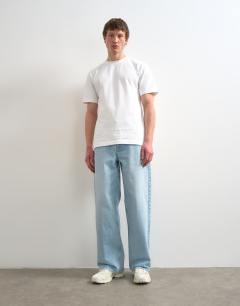 Model wearing Rigid baggy jean in light wash