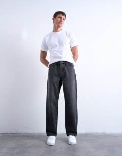 Model wearing Rigid baggy jean in washed black