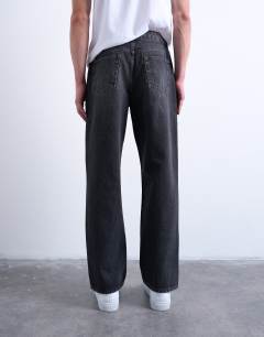 Model wearing Rigid baggy jean in washed black