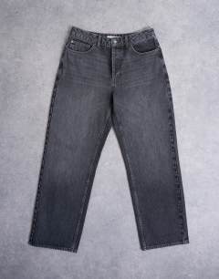Model wearing Rigid baggy jean in washed black