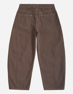 Model wearing Rigid barrel fit jean in clean brown