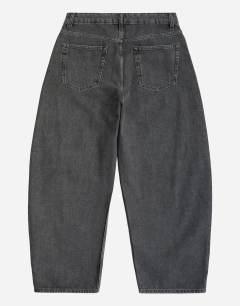 Model wearing Rigid barrel fit jean in washed black