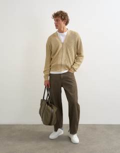 Model wearing Rigid barrel fit jean in washed green