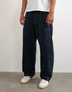 Model wearing Rigid barrel fit panelled jean in clean dark wash