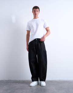 Model wearing Rigid barrel jean in raw black