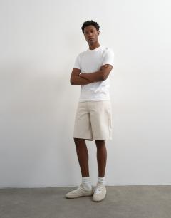 Model wearing Rigid denim short in bone