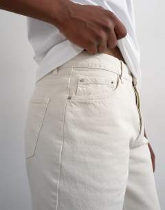 Model wearing Rigid denim short in bone