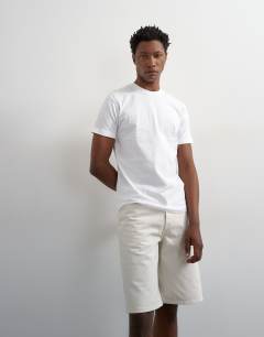 Model wearing Rigid denim short in bone