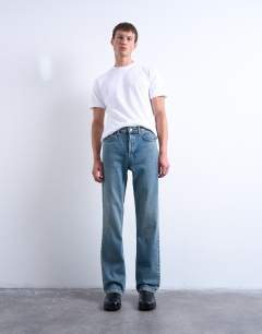 Model wearing Rigid flare jean in mid wash