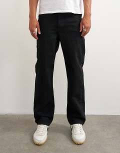 Model wearing Rigid straight fit jean in black