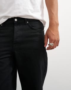 Model wearing Rigid straight fit jean in black