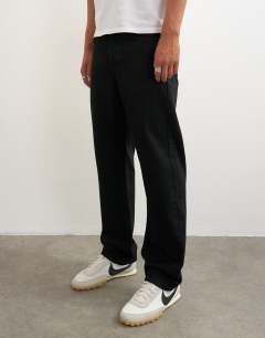 Model wearing Rigid straight fit jean in black