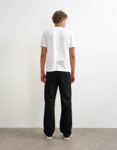 Model wearing Rigid straight fit jean in black