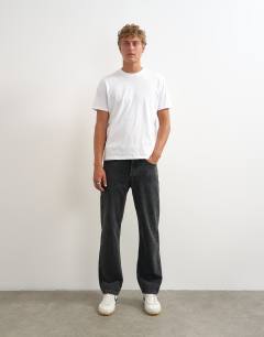Model wearing Rigid straight fit jean in clean washed black