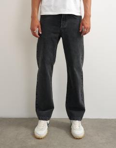 Model wearing Rigid straight fit jean in clean washed black