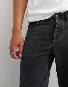 Model wearing Rigid straight fit jean in clean washed black