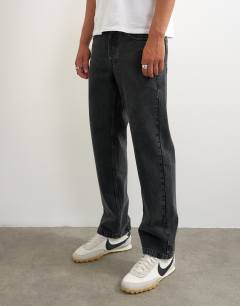 Model wearing Rigid straight fit jean in clean washed black