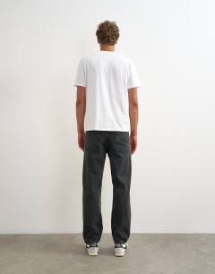 Model wearing Rigid straight fit jean in clean washed black