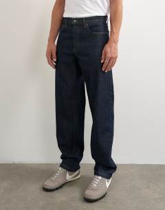 Model wearing Rigid straight fit jean in raw